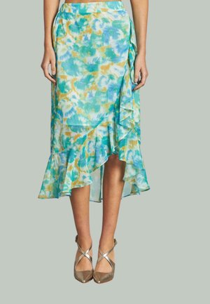 A lightweight, flowy skirt with a blue, green, and orange tie-dye pattern. Features a ruffled hem and an asymmetrical cut.