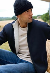 Next Kardiganas - navy borg lined