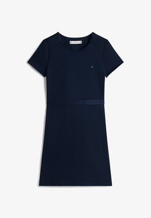 Κοντό φόρεμα σε ναυτικό μπλε με κοντά μανίκια και στρογγυλή λαιμόκοψη. Διαθέτει υφή υφάσματος και αντίθετη μέση με λογότυπο πάνω από το τελείωμα.