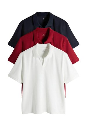 Three ribbed polo shirts stacked, colors white front, red middle, and black back, with short sleeves and open collars.
