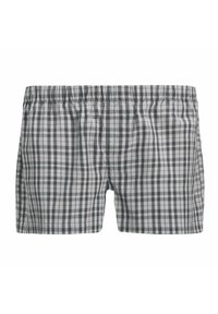 Bañador a cuadros en gris y blanco con cinturilla elástica. Fabricado con un tejido ligero, presenta un diseño holgado.