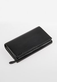 Black leather wallet with a smooth texture, rectangular shape, and a subtle embossed logo on the front. Features a zip closure.