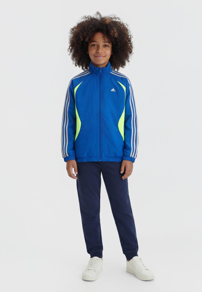 adidas TEAMGEIST LOOSE JUNIOR - Training jacket - collegiate royal/lucid lemon/grey two