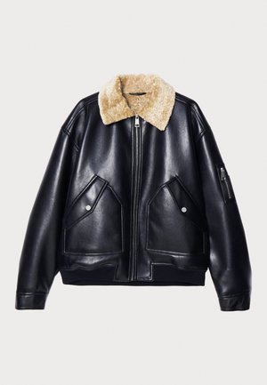 Black leather jacket with shearling collar, featuring two front pockets, a zippered pocket on the sleeve, and ribbed hem and cuffs.