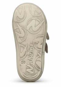 Semelle de chaussure en caoutchouc beige avec un design texturé et un motif circulaire, affichant la marque "Naturino". Taille indiquée comme 20.