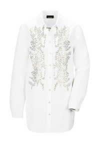 Camicia bianca con un design aderente, caratterizzata da un motivo decorativo di paillettes argentate sul davanti. Maniche lunghe con polsini.