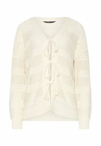 Lätt, krämfärgad stickad cardigan med V-ringning, öppen framsida, dragsko stängning och ett strukturerat mönster genom hela.