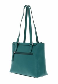 Sac fourre-tout en cuir bleu sarcelle avec double poignée, poche avant zippée et texture lisse. Design robuste avec détails de couture contrastants.