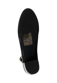 Suola di scarpa nera con una finitura liscia, leggera curvatura sulla punta, una sezione con presa testurizzata sul tallone e un'etichetta incorporata con istruzioni per la cura.
