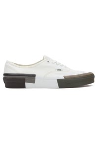 White canvas sneakers with a low-top design. Features a multi-colored rubber outsole in black, brown, and green accents. Classic lace-up style.