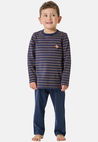 Navy blue pajamas featuring long sleeves and pants. Top has orange horizontal stripes with a small fox graphic on the chest. Soft cotton texture.