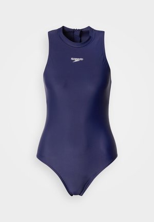 Laivastonsininen, hihaton uimapuku, joka on valmistettu sileästä kankaasta. Siinä on korkea kaulus ja takana vetoketju. Pieni valkoinen Speedo-logo rinnassa.