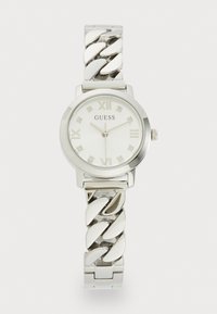 Reloj plateado redondo con una esfera blanca, marcadores de números romanos y una pulsera de cadena enlazada. Presenta pequeñas piedras decorativas en la esfera.