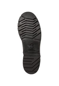 Semelle de botte en caoutchouc noir avec un motif de crampons en zigzag, présentant un logo circulaire et un texte en relief, conçue pour l'adhérence et la durabilité.