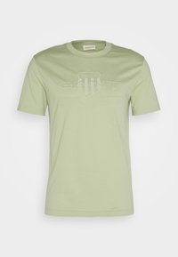 TONAL SHIELD - Camiseta estampada - milky matcha