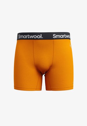 Boxer shorts Smartwool en color naranja con una cinturilla negra con logo, fabricados en material suave, con un diseño ceñido y detalles de costura.