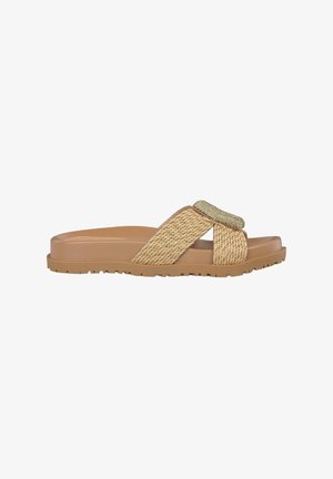 Tan slide sandal with woven straw accents, a flat rubber sole, and a textured golden embellishment on the upper strap.
