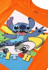 Disney T-shirt med print - orange