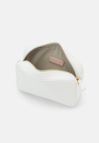 Coccinelle TEBE - Cross body bag - brillant-white