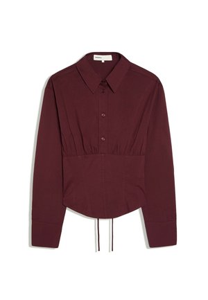 Dark burgundy long-sleeve shirt with collar, button front, fitted waist, and drawstring at hem, displayed on a white background.
