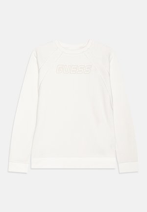 Biała bluza z okrągłym dekoltem, długimi raglanowymi rękawami i teksturowanym logo "GUESS" z przodu. Miękki materiał z prążkowanym wykończeniem u dołu.