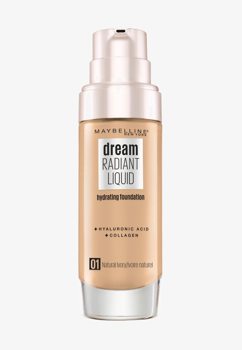 Nawilżający podkład w przezroczystej szklanej butelce z pompką, oznaczony etykietą "Dream Radiant Liquid", w naturalnym odcieniu kości słoniowej z złotymi akcentami.