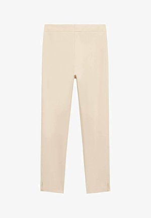 Beżowe spodnie stretchowe o gładkiej fakturze, dopasowany krój i boczne rozcięcia na końcach. Zaprojektowane z wysokim stanem.