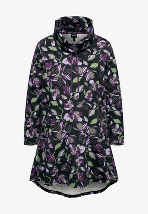 Blomster tunika i mørkegrøn, med store lilla og grønne blomster mønstre, kravehals, lange ærmer og en flared kant.