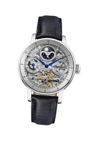 Montre en acier inoxydable argenté avec un cadran transparent, des accents bleus et un bracelet en cuir noir mettant en valeur des détails mécaniques complexes.