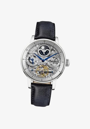 Zilveren roestvrijstalen horloge met een transparante wijzerplaat, blauwe accenten en een zwarte leren band die ingewikkelde mechanische details toont.