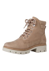 Stivaletto in pelle beige con punta tonda, chiusura con lacci e suola in gomma resistente. Presenta dettagli di cucitura e occhielli in metallo.