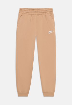 Beige Nike-Sweatpants mit einem Kordelzugbund, seitlichen Taschen, elastischen Bündchen und einem weißen Logo am linken Bein. Weicher Materialtextur.