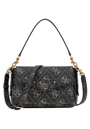 Black Guess handbag with gray logo pattern, gold hardware, short handle, and adjustable shoulder strap on a white background.