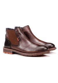 Botas de tobillo de cuero marrón con paneles laterales elásticos, textura lisa, puntera redondeada y acentos de suela de goma naranja en contraste.