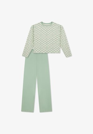 Top corto a maniche lunghe con motivo a scacchi verde chiaro e beige e pantaloni larghi verde chiaro abbinati a tinta unita.