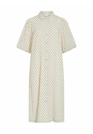 Kremasta midi haljina s crnim točkicama, kratkim puff rukavima, prednjim kopčanjem na gumbe i malim ovratnikom.