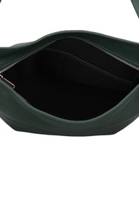 Borsa a mano in pelle verde con esterno strutturato, interno spazioso e chiusura superiore con cerniera. L'interno presenta una fodera in tessuto scuro.