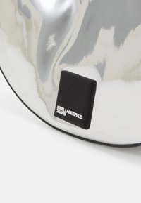 Karl Lagerfeld Jeans TECH HALFMOON - Τσάντα χειρός - silver-coloured/mirror