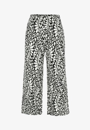 Sort-hvide bukser med vide ben, høj talje og et abstrakt bladlignende mønster overalt på stoffet.