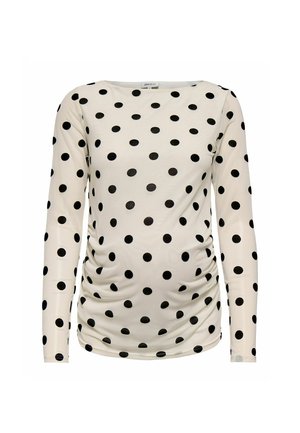 Hvit langermet ammetopp med svarte polkadotter og rynkede sider for strekk og komfort.