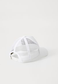 White cap featuring a solid front panel and mesh back. Curved brim with adjustable plastic strap at the rear.