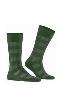 Calzini verdi con un motivo a righe in diverse tonalità di verde. Realizzati in morbido tessuto, con polsini a coste e una superficie liscia.