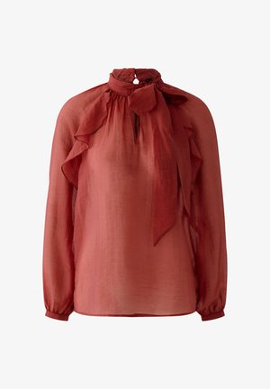 Doorzichtige roestkleurige blouse met lange mouwen, ruches op de schouders en een striksluiting bij de hals.