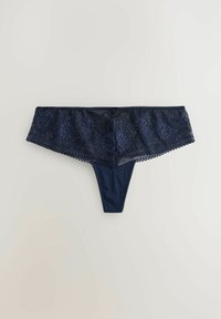 Slip en dentelle bleu marine avec broderie florale, une taille en dentelle transparente et un corps en tissu lisse. Des bords festonnés délicats ajoutent une touche de détail.