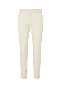 Jasnobeżowe chinosy o wąskim kroju, z zapięciem na guziki i elastycznymi ściągaczami przy kostkach. Wykonane z lekkiej bawełnianej tkaniny.