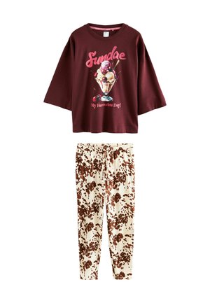 Burgundy short-sleeve t-shirt with ice cream graphic and text; cream pants with brown splotchy pattern; casual lounge set.