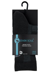 Chaussettes de trekking en laine mérinos de couleur gris foncé avec un design texturé. Emballées sur une carte noire avec un crochet et des indicateurs de taille.