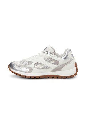 White sneaker with silver accents, mesh and suede detailing, rubber outsole, rounded toe, and lacing system. Textured design elements featured.