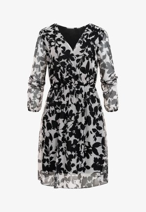 Robe noire et blanche à fleurs, longueur genou, avec manches longues transparentes, devant croisé en V, et taille cintrée.