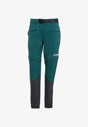 Pantalons techniques verts avec des accents noirs, dotés d'une ceinture, de poches latérales et d'un design fuselé pour un ajustement moderne.